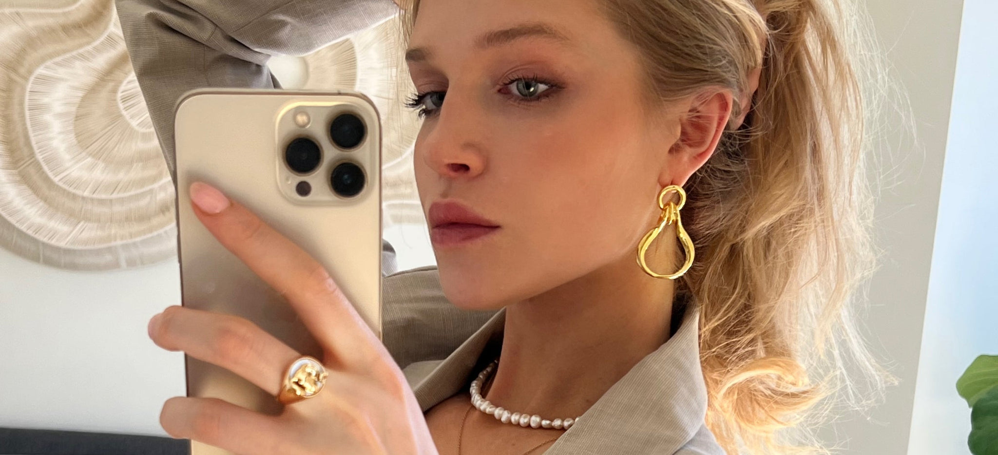 model wearing ÉMILLIE ANNE tusk earrings