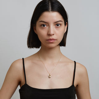 Model wearing gold necklace