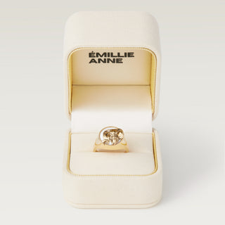 Gold elephant ring in jewelry box