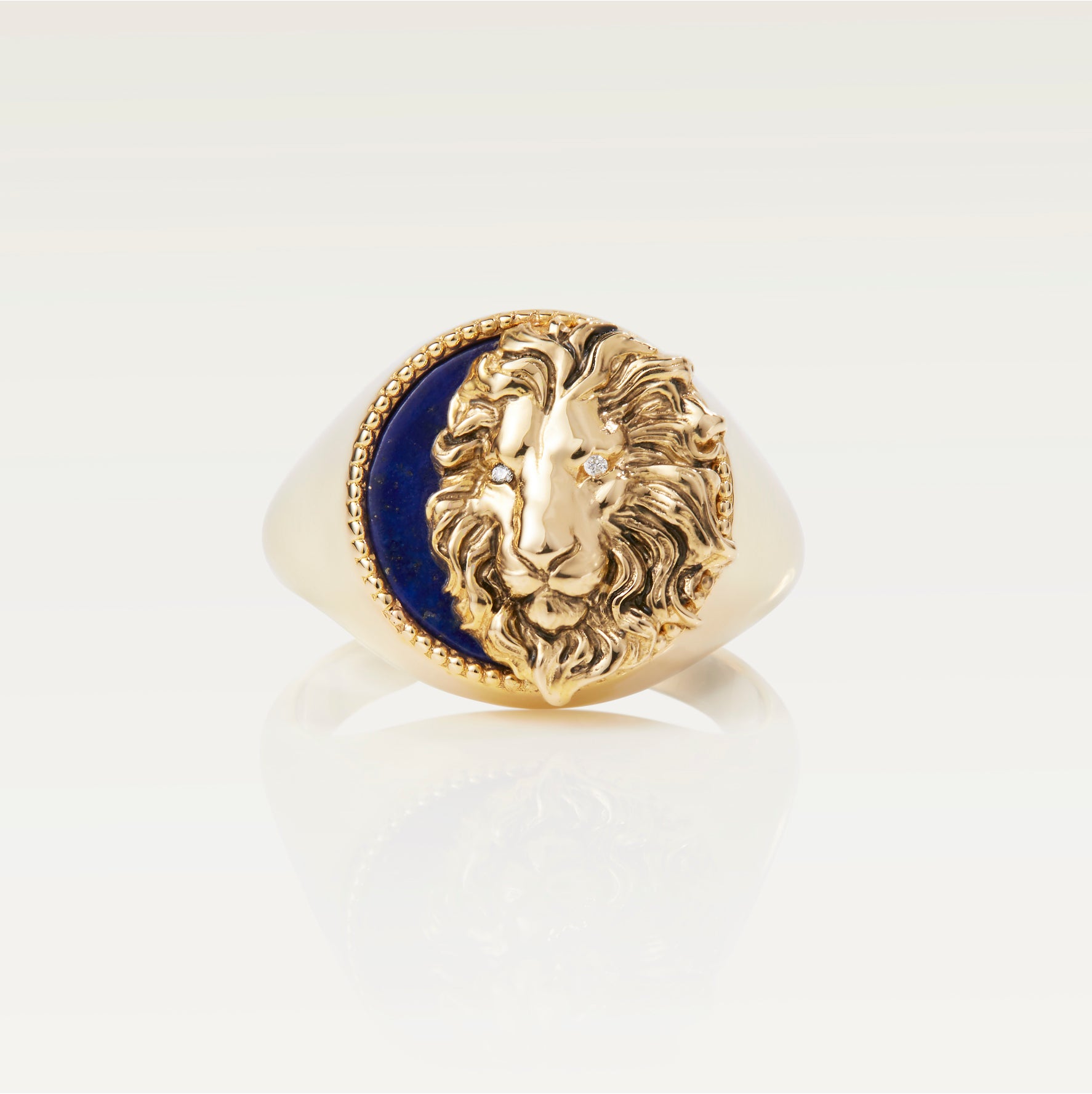 Sold at Auction: An 18ct gold signet ring with engraved lion