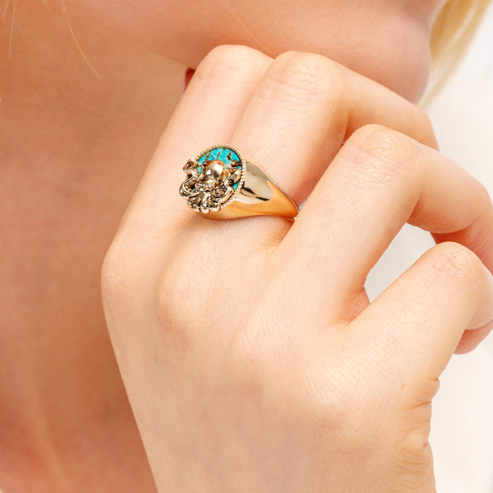 Model with gold octopus ring