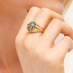 Model with gold octopus ring