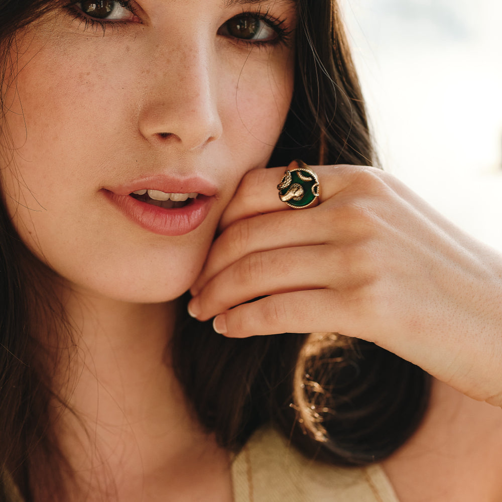 Model with gold snake ring