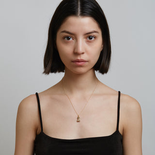 Model wearing gold necklace